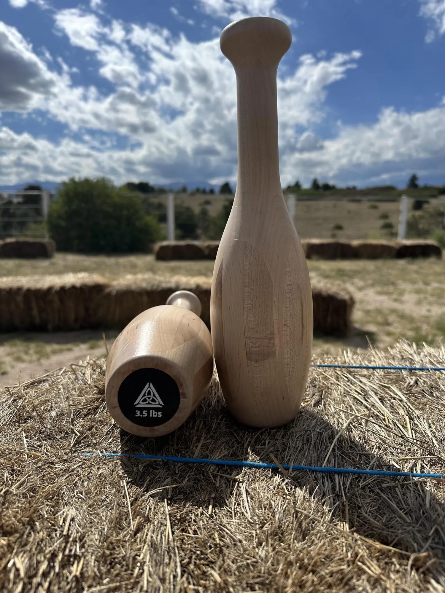 Abide Trail Club, a hand-turned hard maple fitness club engraved with the Abide mark