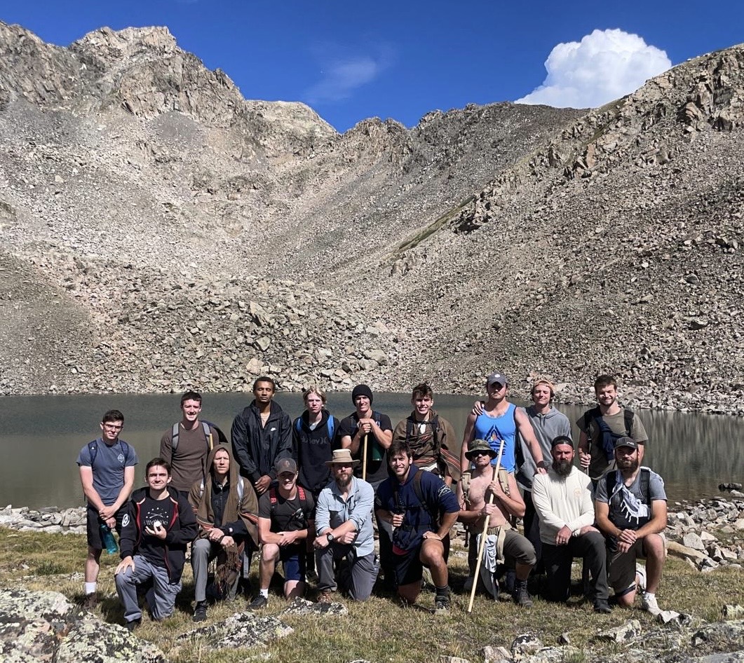Young men and mentors from the Abide Project gathered at a mountain lake in Colorado during the Live 90 Program